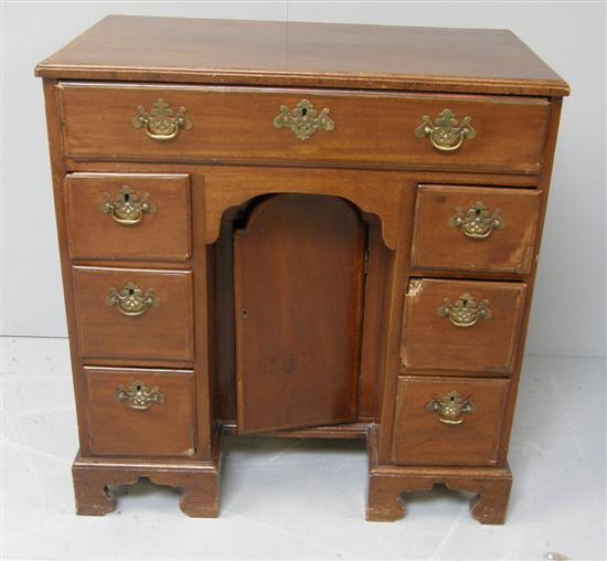 Appraisal: George III mahogany kneehole desk with seven drawer configuration and