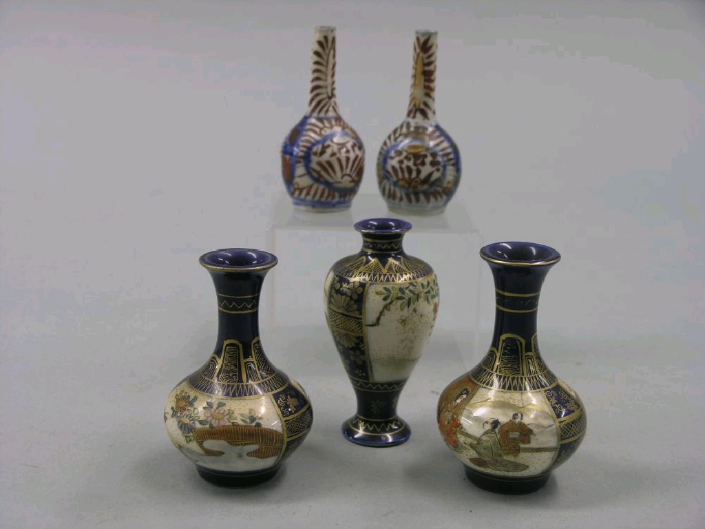 Appraisal: A pair of miniature Satsuma vases globe-and-shaft form another baluster-shape