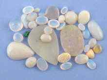 Appraisal: A quantity of loose polished opals approx carats