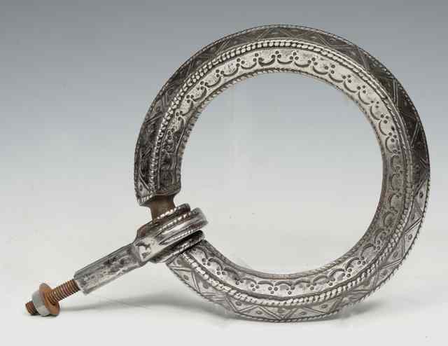 Appraisal: A POLISHED STEEL CIRCULAR DOOR KNOCKER with stamped decoration diameter