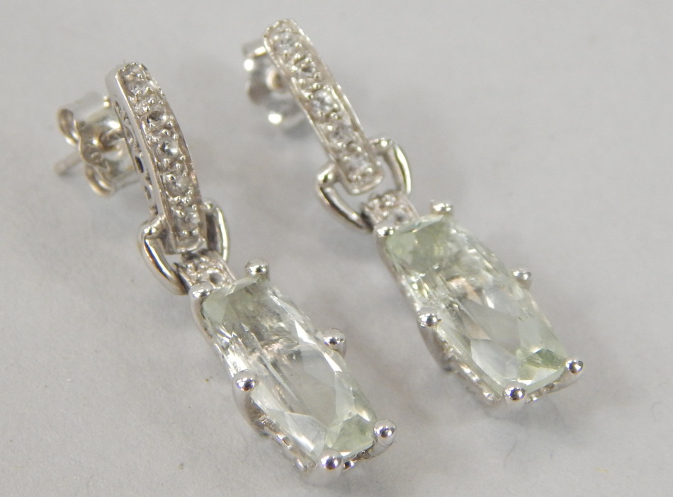 Appraisal: A pair of earrings set with pale bluey green stones