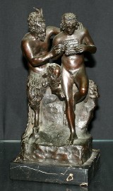 Appraisal: A bronze figural group of Pan and a Satyr after