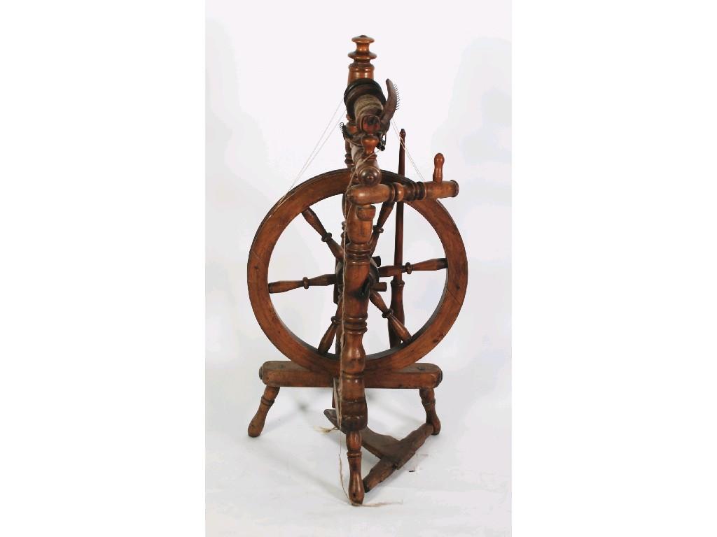 Appraisal: NINETEENTH CENTURY BEECH SPINNING WHEEL with tripod base cm high