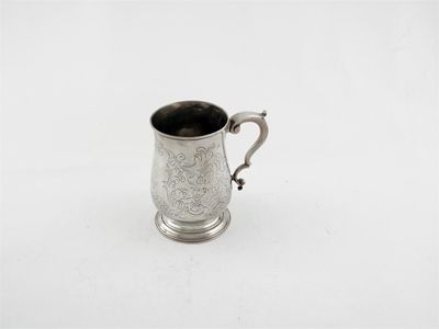 Appraisal: A George III mug with later engraved decoration scrolling handle