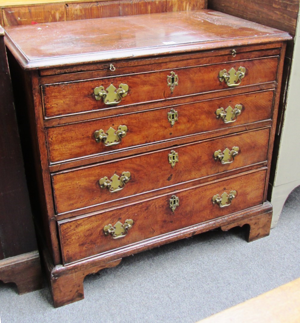 Appraisal: A mid th century mahogany chest the brushing slide over