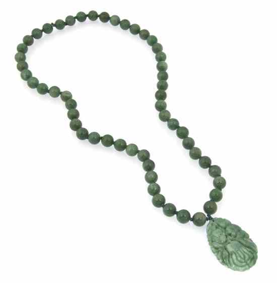 Appraisal: A Green Hardstone Bead Necklace with green hardstone fruit motif