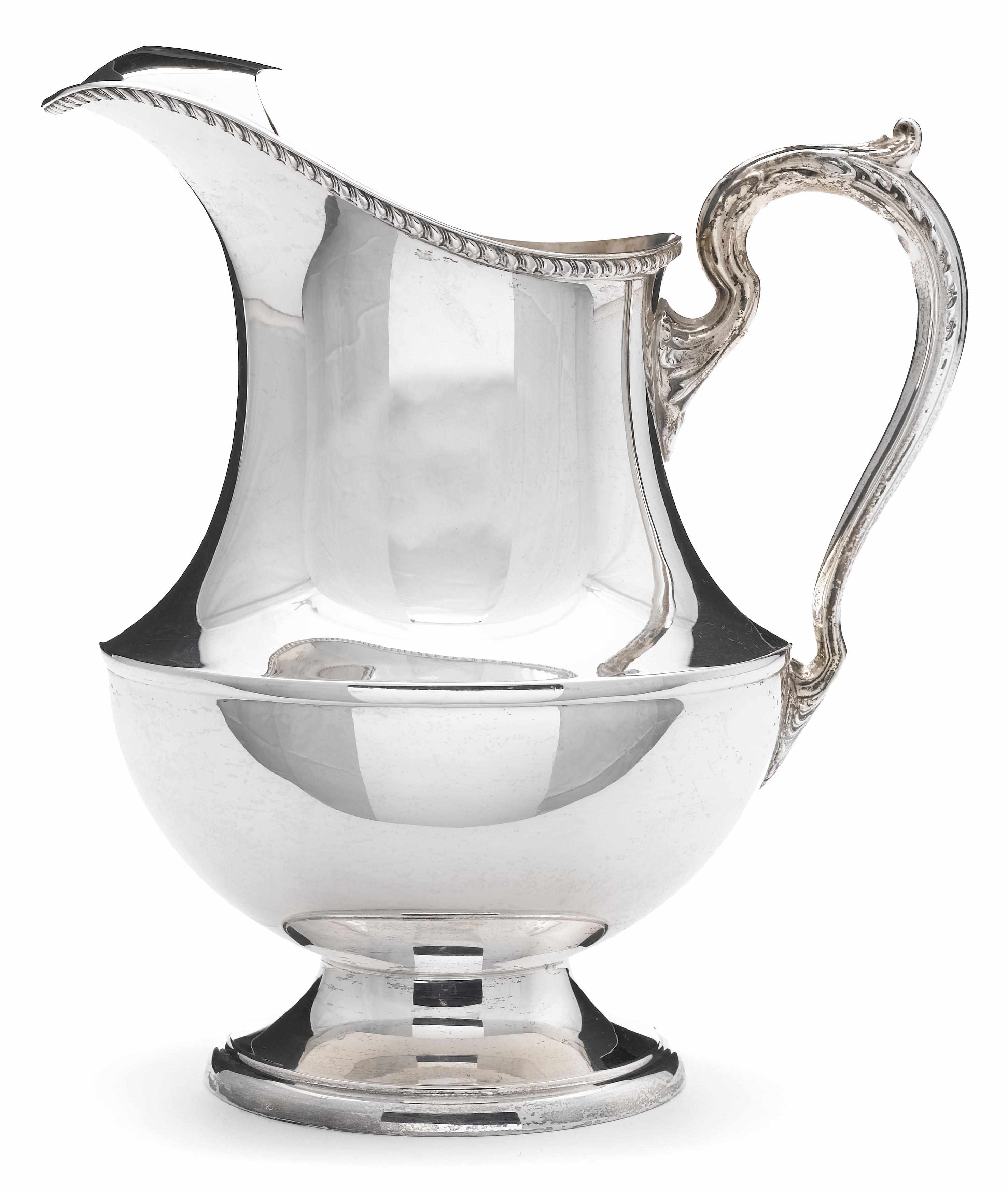 Appraisal: A sterling water pitcher with ice guard Poole Silver Co