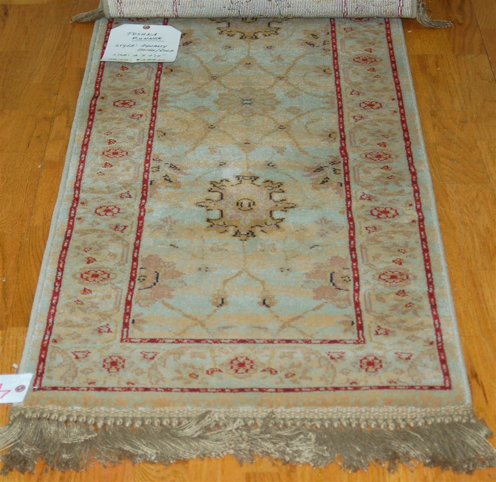 Appraisal: MACHINE MADE RUNNER consisting of an oriental pattern in tan