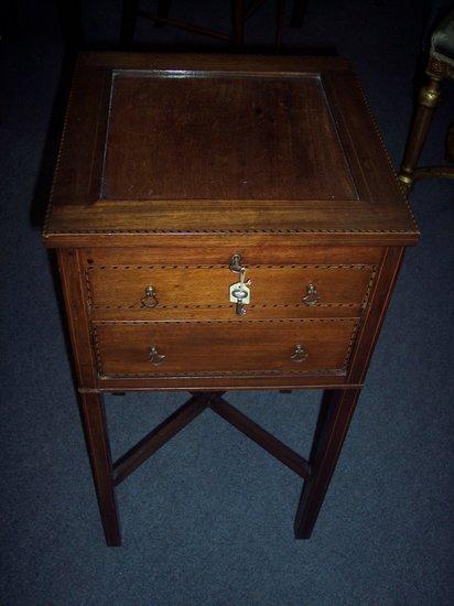 Appraisal: An Edwardian work table with cable border the square hinged