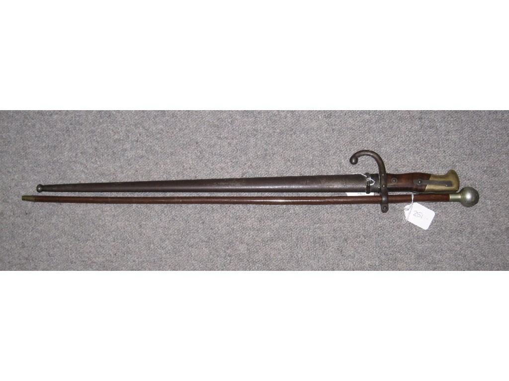 Appraisal: Lot comprising bayonet in scabbard and a swagger stick