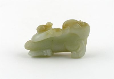 Appraisal: A Chinese celadon jade carving of a recumbent horse with