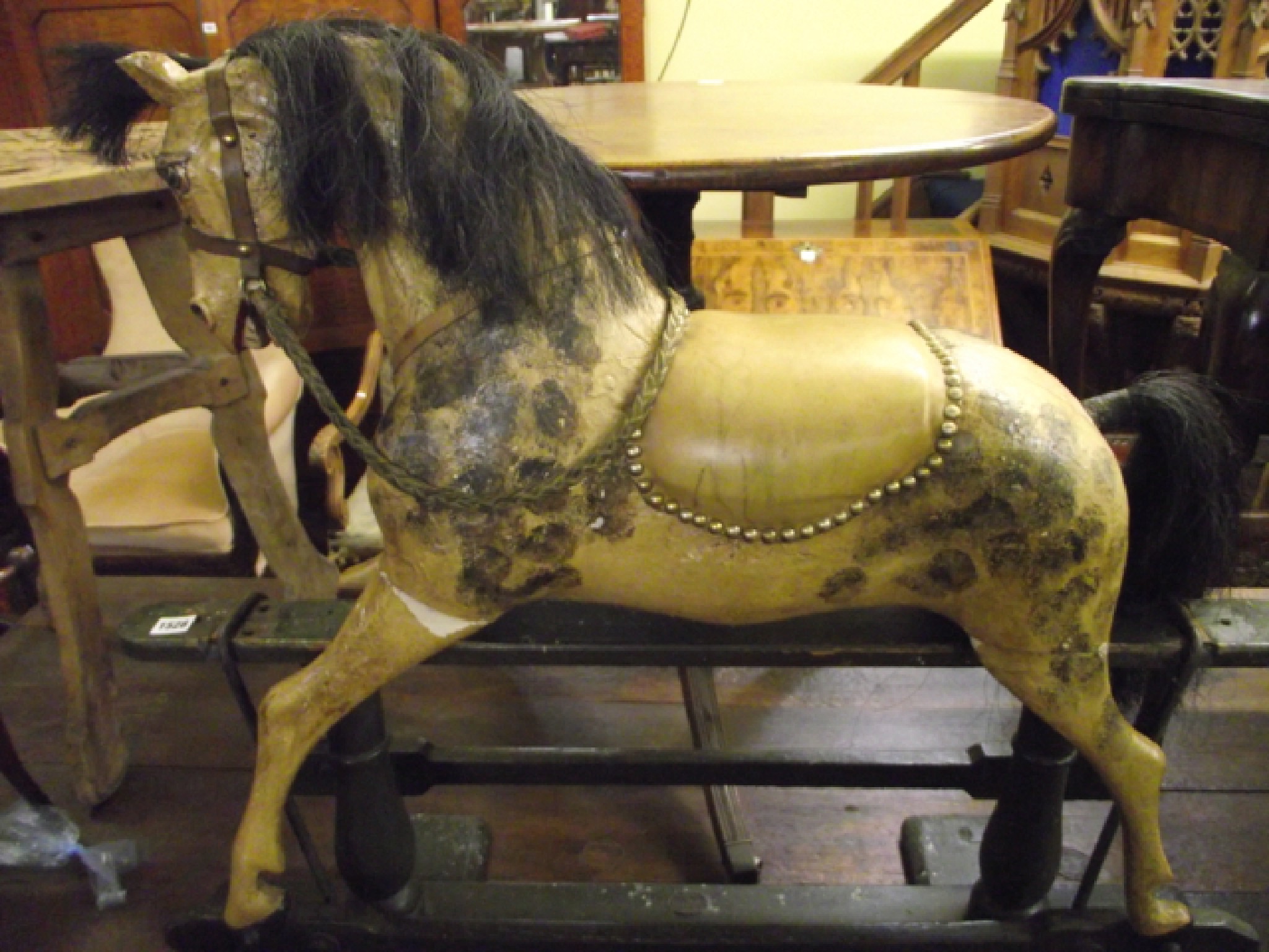 Appraisal: A th century painted rocking horse with dappled finish raised