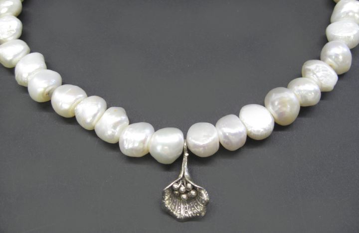 Appraisal: Unusual Silver and Freshwater Pearl Necklace composed of a strand