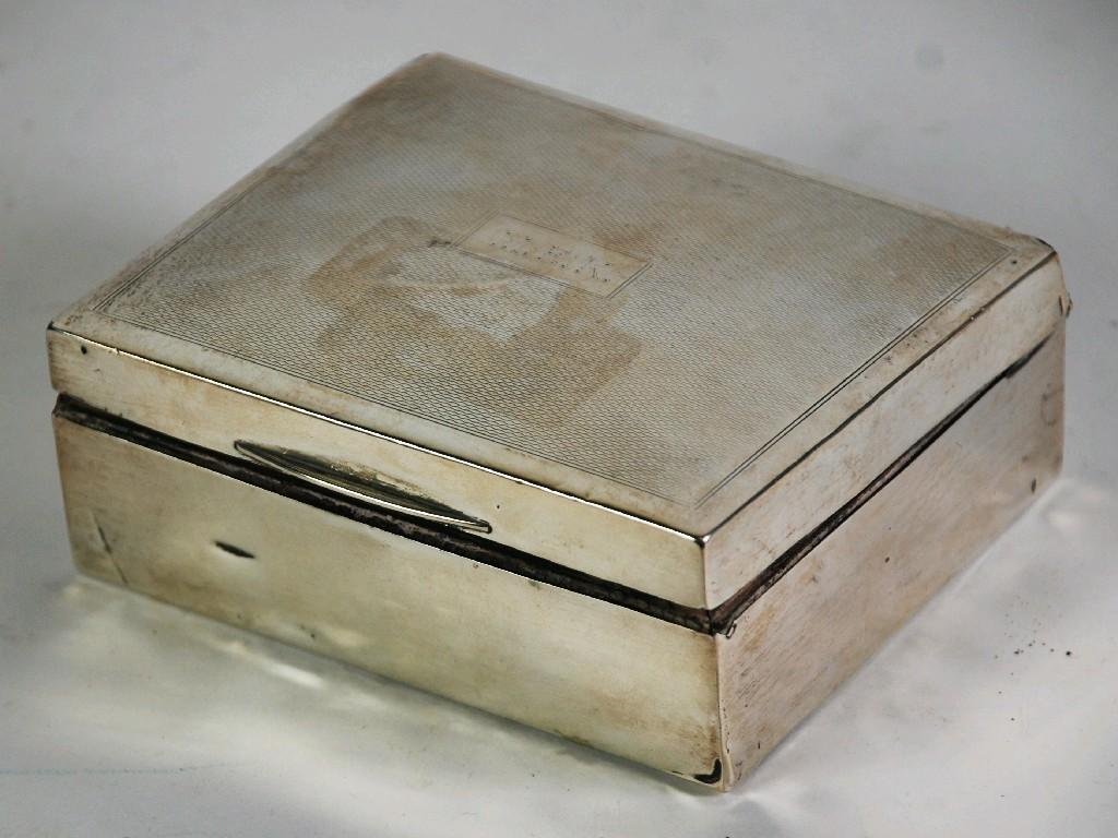 Appraisal: SILVER TABLE CIGARETTE BOX oblong and engine turned with slightly