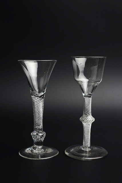 Appraisal: AN ANTIQUE WINE GLASS of flared conical form with air