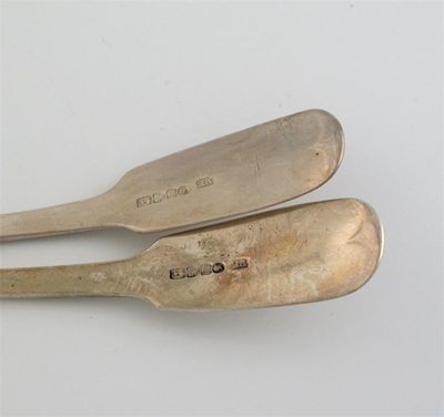 Appraisal: A pair of Victorian provincial fiddle sauce ladles crested by