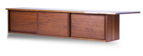 Appraisal: GEORGE NAKASHIMA Walnut wall-hanging cabinet with overhanging free-edge top and