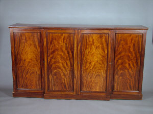 Appraisal: A Victorian breakfront cupboard th century the shaped top above