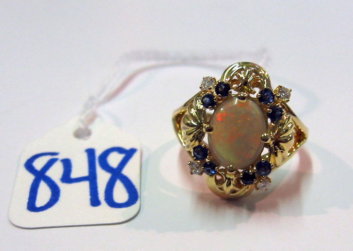 Appraisal: OPAL SAPPHIRE DIAMOND AND FOURTEEN KARAT GOLD RING Four round-cut