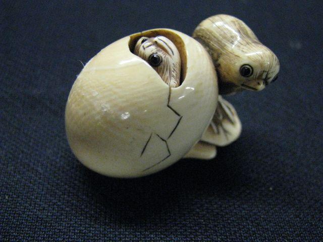 Appraisal: Carved Ivory Netsuke of Chick Beside Another chick emerging from