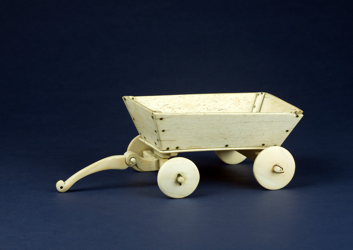 Appraisal: CARVED WHALE IVORY TOY CART MADE ABOARD THE WHALER NAUTICON