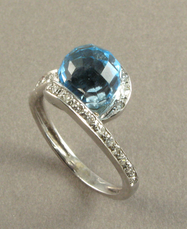 Appraisal: BLUE TOPAZ DIAMOND AND WHITE GOLD RING set with a