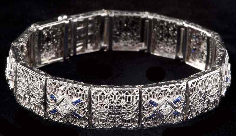 Appraisal: Edwardian Diamond Braceletcomposed of white gold filigree links alternating with