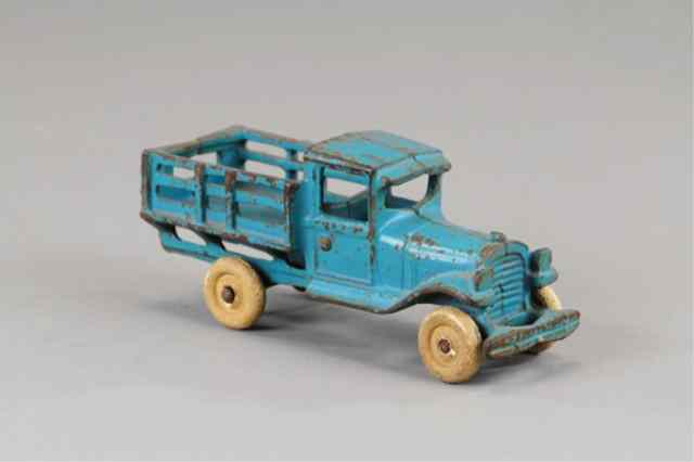 Appraisal: ARCADE STAKE TRUCK Cast iron painted in blue overall enclosed