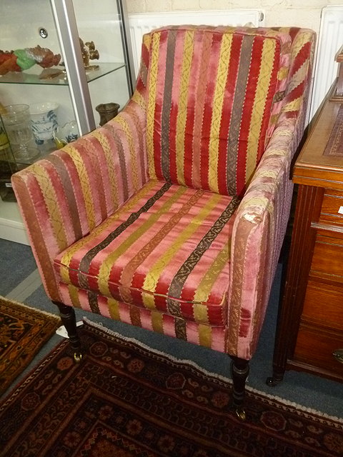 Appraisal: A MATCHED PAIR OF DEEP SQUARE SET ARMCHAIRS standing on