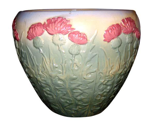 Appraisal: WELLER Massive Etna jardiniere decorated with pink flowers on tall