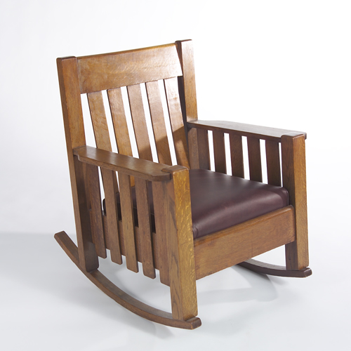 Appraisal: Phoenix rocking chair with paddle arms and five vertical backslats