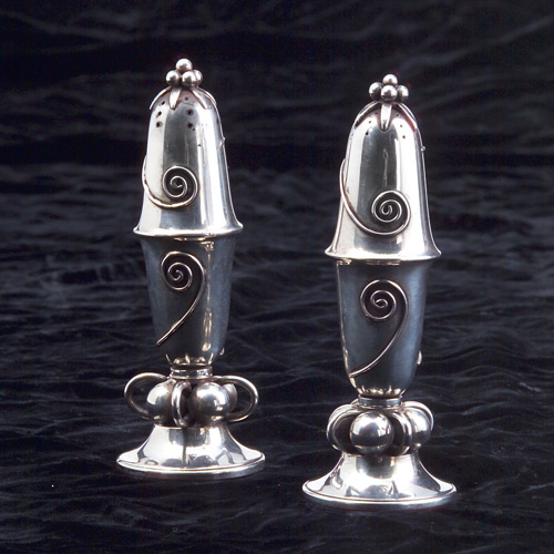 Appraisal: Pair of Meyer salt and pepper shakers Scroll and ball