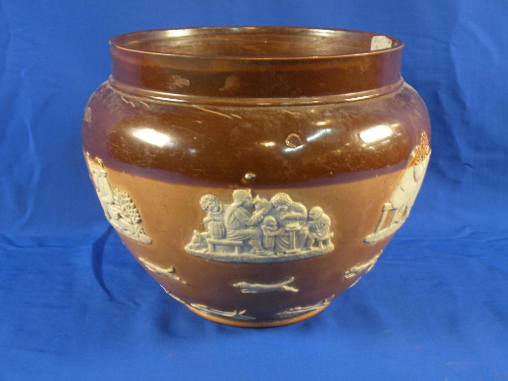 Appraisal: A Royal Doulton stoneware jardiniere decorated in relief with rural