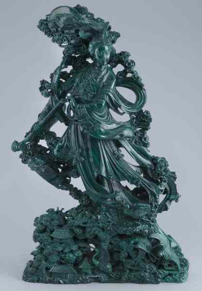 Appraisal: Large Chinese carved malachite carvingdepicting a beauty surrounded by flowers