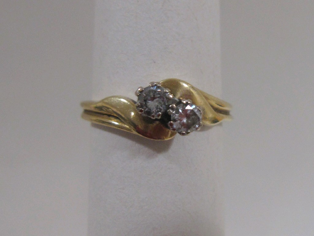 Appraisal: Eighteen carat gold diamond two stone twist ring