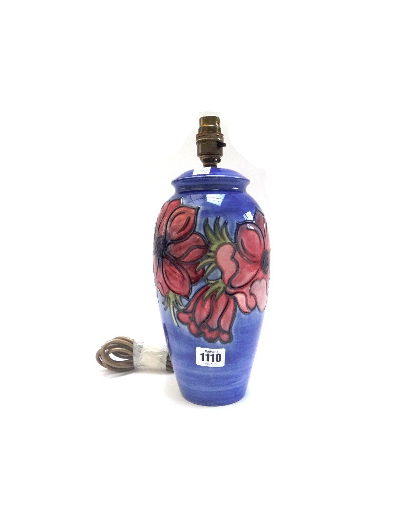 Appraisal: A Moorcroft pottery blue ground table lamp decorated with a