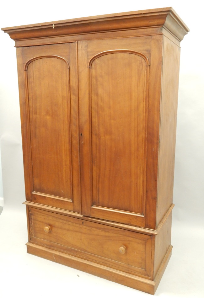 Appraisal: A Victorian satin walnut wardrobe with two panel doors above