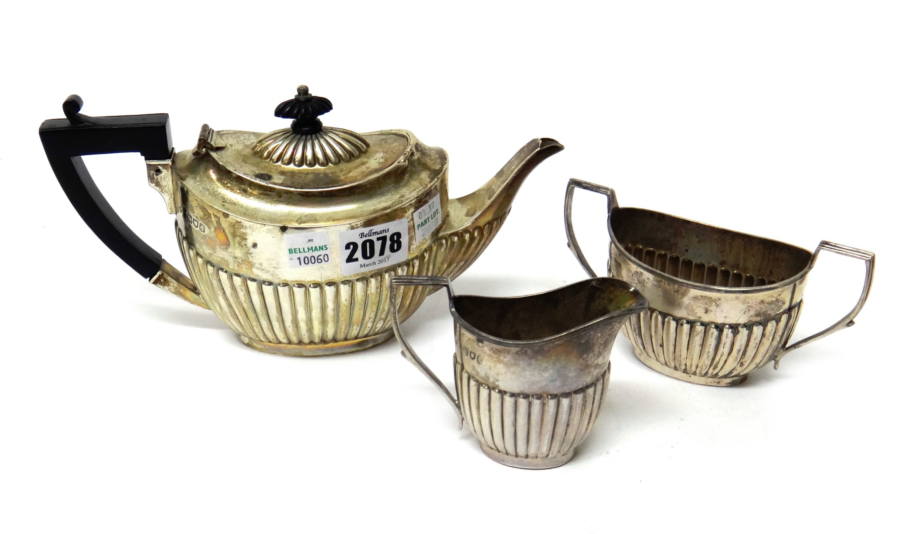 Appraisal: A late Victorian silver composite three piece tea set comprising