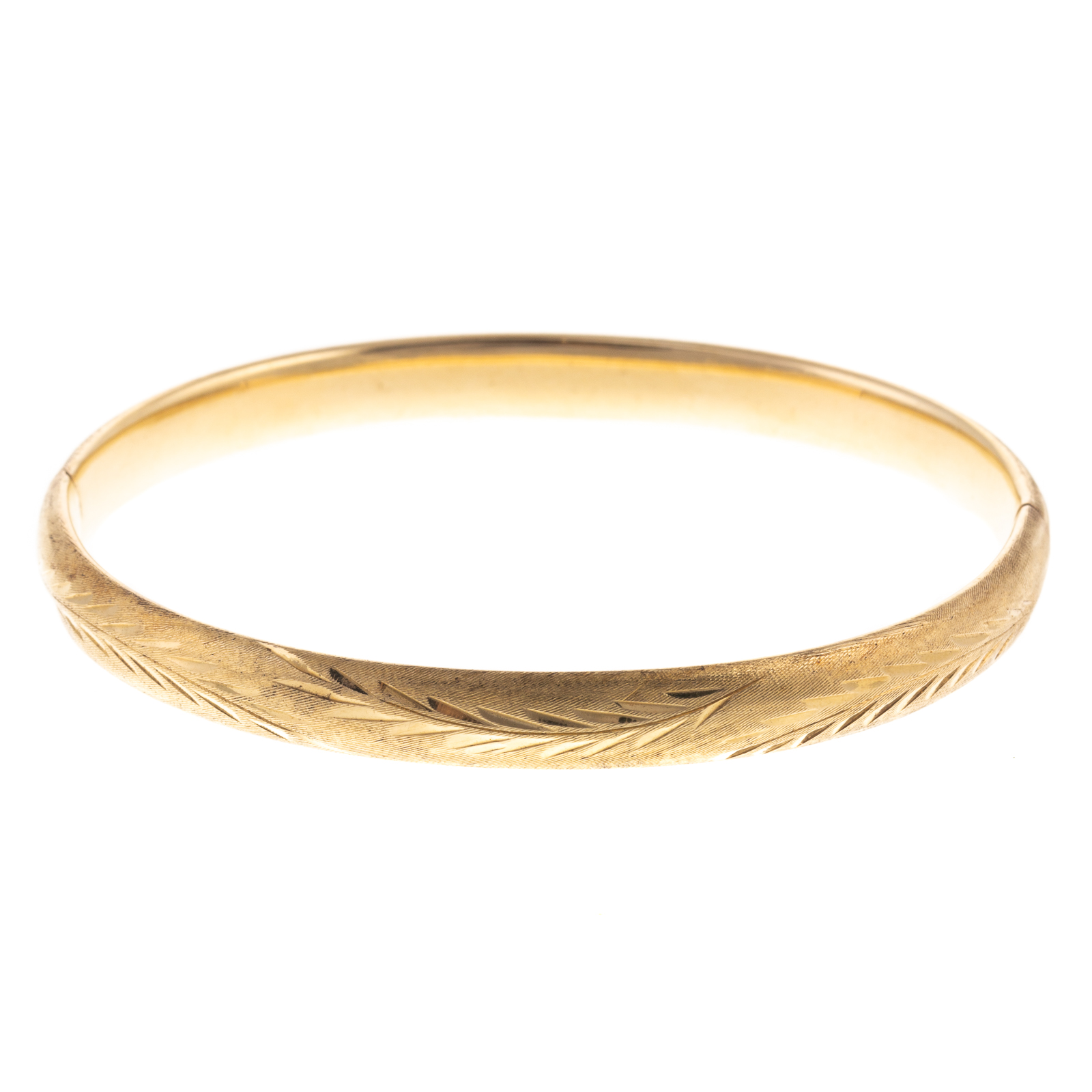 Appraisal: AN ENGRAVED BANGLE IN K YELLOW GOLD K yellow gold