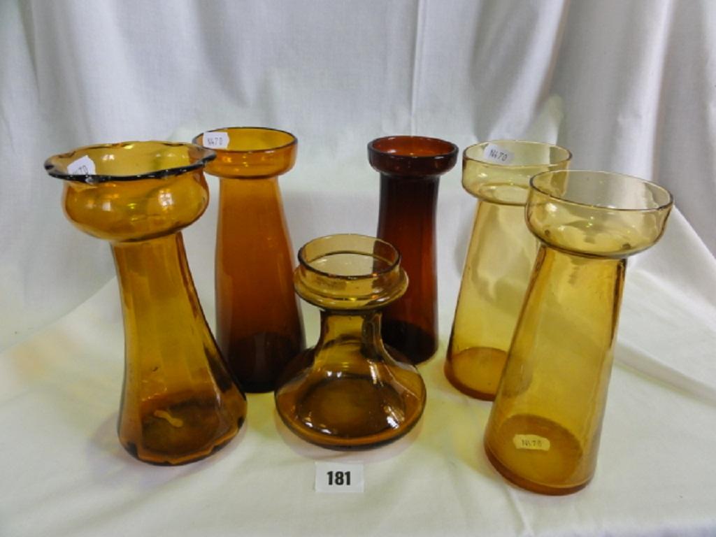 Appraisal: A collection of six various amber coloured Hyacinth vases of