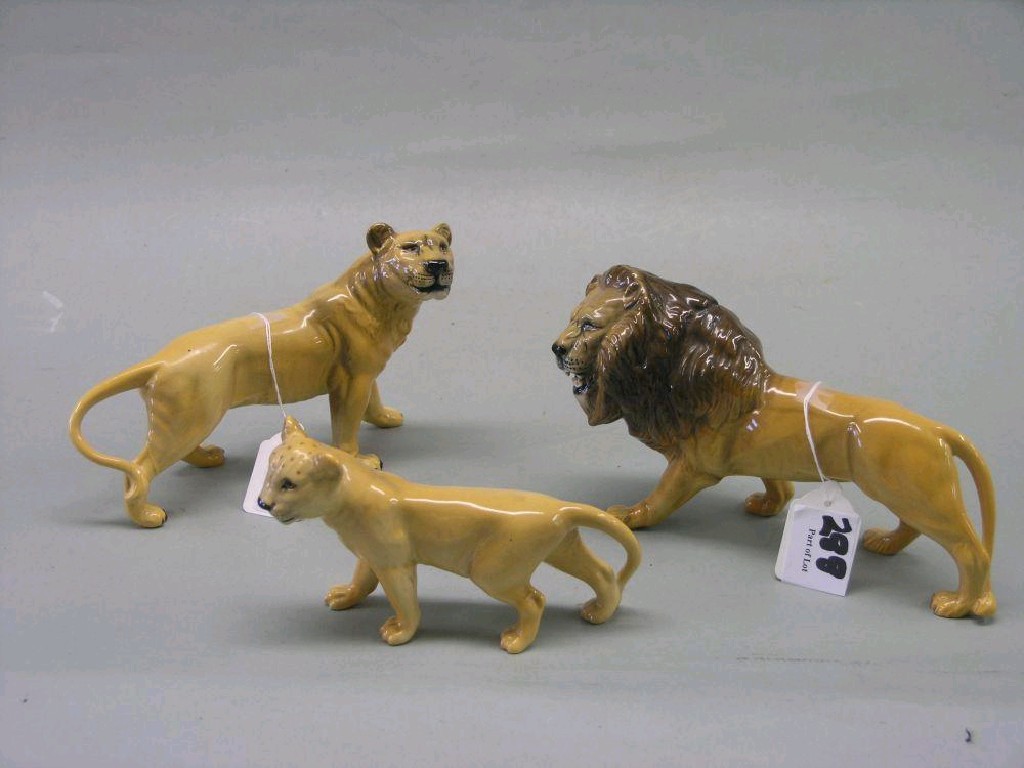 Appraisal: Three Beswick wild animals lion facing left lion cub facing