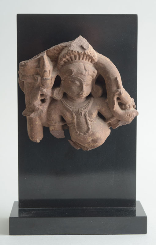 Appraisal: INDIAN CARVED SANDSTONE FRAGMENT Depicting a crowned dancer wearing earrings