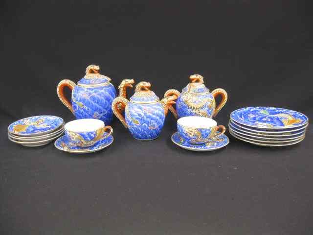 Appraisal: Japanese Moriage Dragon Porcelain Tea Set includes teapot creamer sugar