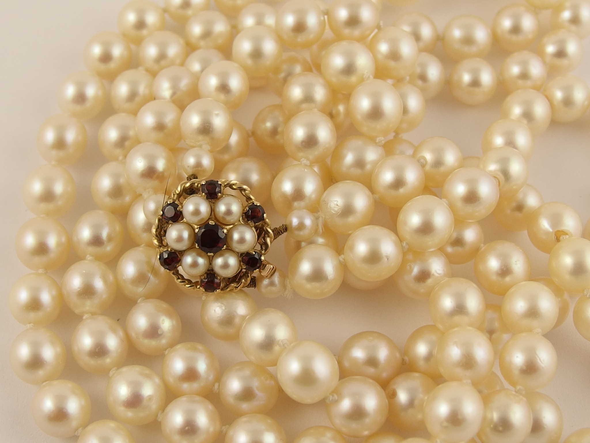 Appraisal: A double string of cultured pearls with a ct pearl