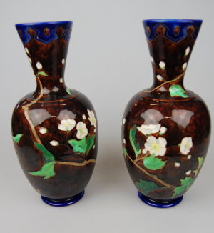 Appraisal: Pair of Sarraguemines majolica vases decorated with tube lined blossom