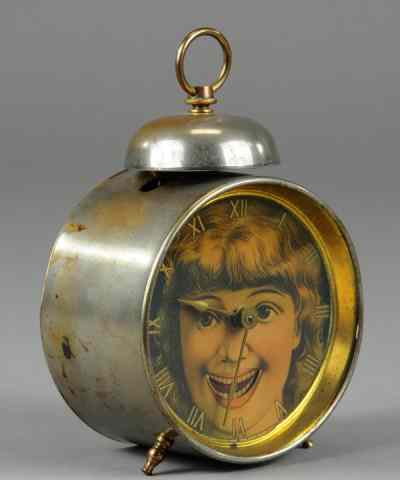 Appraisal: ANIMATED ALARM CLOCK Pat paper face of girl with moving