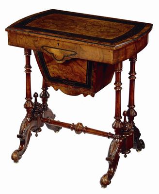 Appraisal: A Victorian walnut work table the hinged top to a