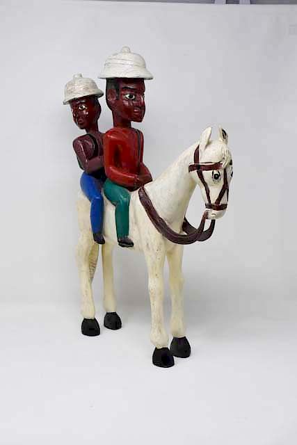 Appraisal: Folk art wood carving of horse two riders Folk art