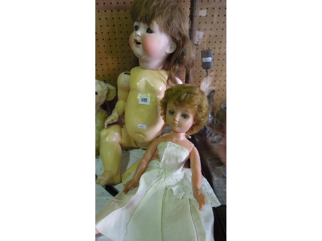 Appraisal: A baby doll with ceramic head composition body mark to