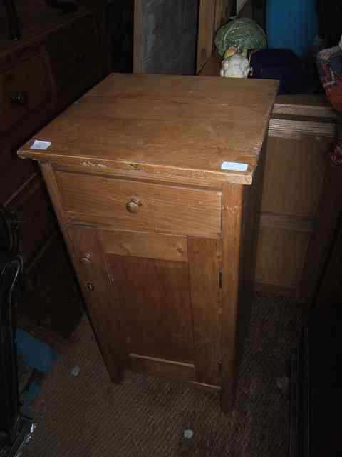 Appraisal: AN OLD PINE POT CUPBOARD wide a pine side table